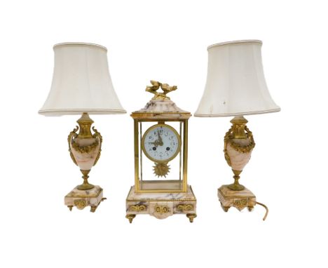 A late 19th/early 20th French gilt metal and marble clock garniture, the clock with enamel dial and Arabic numerals, embellis