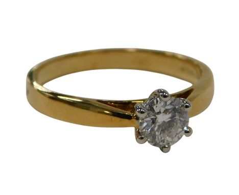 An 18ct gold diamond solitaire ring, set with round brilliant cut diamond approx 0.4cts, claw set, white gold setting on yell