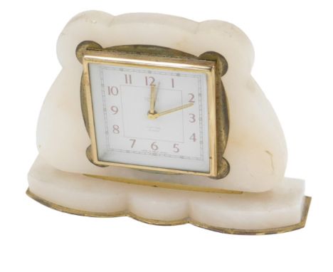 A Smith's eight day alarm mantel clock, in a white onyx case, with gilt metal mounts, 17cm wide.