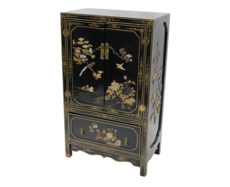 An oriental black lacquered cabinet, with soapstone and mother of pearl Shiboyama style inlay of birds, flowers, etc., with t