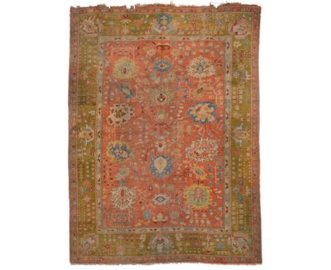 Borlu Carpet of unusual size Central/West Anatolia, circa 1900 The coral pink field with columns of stylised flowerheads and 