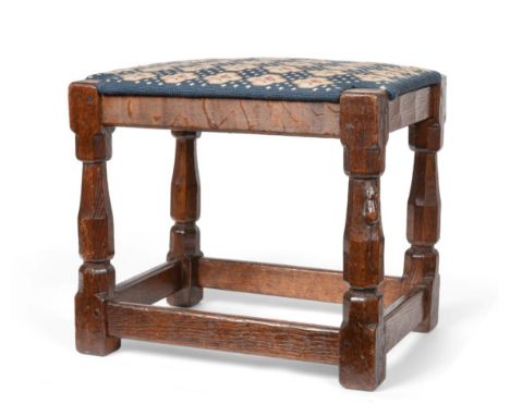 A Robert ''Mouseman'' Thompson Oak Stool, with later tapestry upholstered drop in seat, on four octagonal legs joined by stre