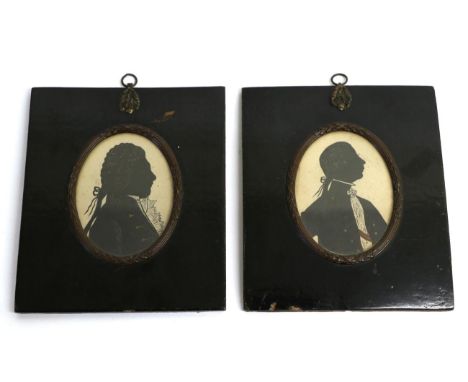 A Pair of Portrait Silhouettes of Alexander Hamilton and A Gentleman, circa 1800, both bust length wearing white stocks, oval