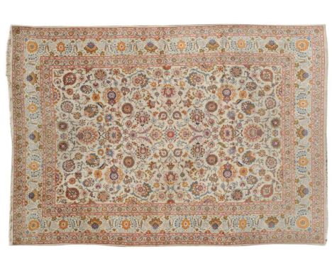 Good Kashan Carpet Central Iran The ivory field with an allover design of scrolling flowering vines framed by similar borders