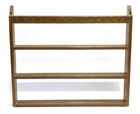 A Robert ''Mouseman'' Thompson Oak Open Delft Rack, three fixed shelves below a penny moulded frieze, the two uprights each c