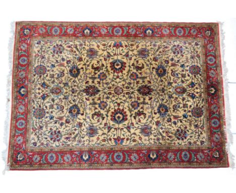 Ghom Carpet Central Iran The ivory field of palmettes, vines and animals enclosed by blood red meandering vine borders, 320cm