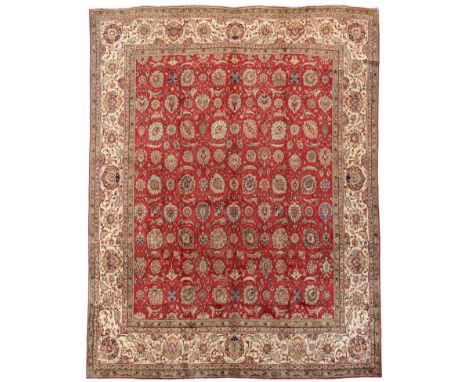 Tabriz Carpet, of unusual size Iranian Azerbaijan, circa 1950 The deep brick red field with an allover design of flowing vine