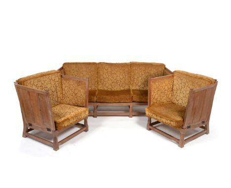 A Derek ''Fishman'' Slater Panelled Oak Three Piece Suite, comprising a sofa, with drop-ends, on four turned octagonal and bl