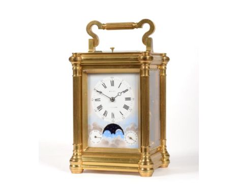 A Brass Striking Repeating Alarm Carriage Clock with Unusual Calendar and Moonphase Displays, retailed by Muller, Twickenham,