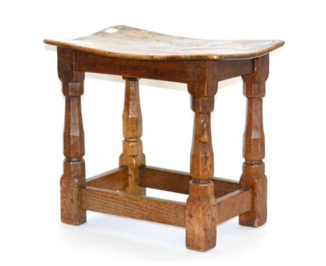 A Robert ''Mouseman'' Thompson Burr Oak Dish Topped Stool, on octagonal legs joined by stretchers, with carved mouse signatur