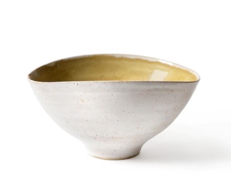Dame Lucie Rie (1902-1995) and Hans Coper (1920-1981): A Stoneware Bowl, of elliptical form, pitted oatmeal glaze to exterior