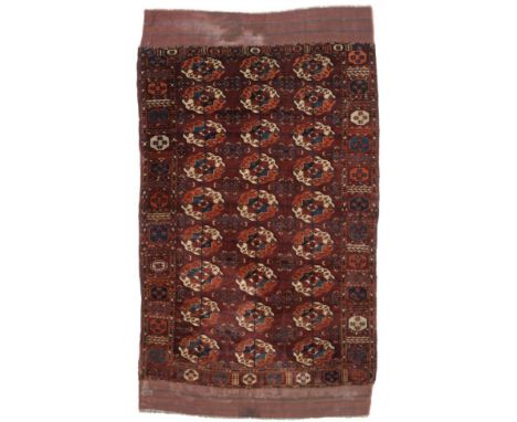 Tekke Carpet (reduced in size, now as a rug) Emirate of Bukhara, mid 19th century The deep madder field with three columns of