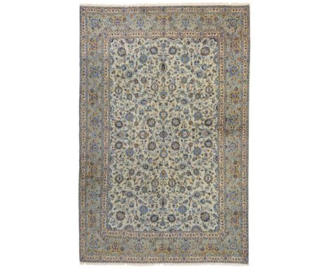 Kashan Carpet Central Iran, circa 1960 The ice blue field with an allover design of scrolling vines and palmettes enclosed by