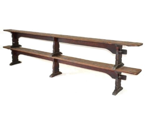 A Pair of Robert ''Mouseman'' Thompson Oak 12ft Benches, on three shaped supports, joined by a rail (top), unmarked, 366cm wi