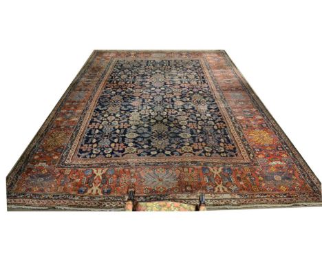 Large Feraghan Carpet West Iran, circa 1860 The indigo field with an allover design of plants and palmettes within a lattice 