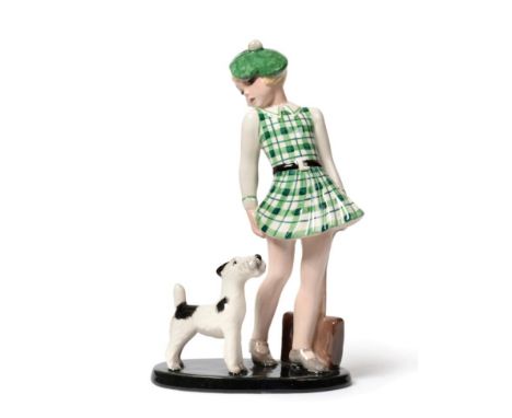 An Art Deco Goldscheider Figure, circa 1936, model 7274, a school girl with her terrier, wearing a green check dress and hat,