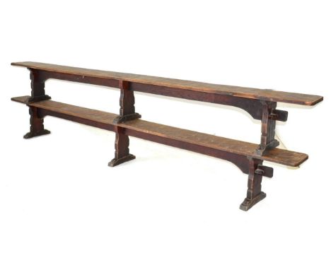 A Pair of Robert ''Mouseman'' Thompson Oak 12ft Benches, on three shaped supports, joined by a rail (top), unmarked, 366cm wi