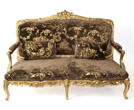 A 19th Century Giltwood and Gesso Two-Seater Sofa, in Louis XV style, recovered in brown and gold velvet, with a moulded and 