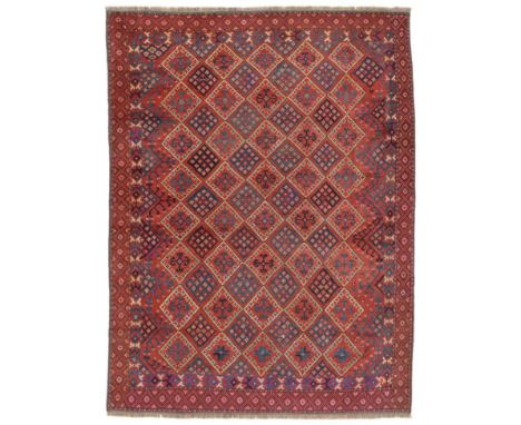 Ersari Main Carpet Central Amu Darya Region, 19th century The madder diamond lattice field of stellar motifs and hooked cruci