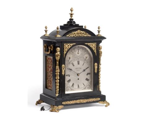 An Ebonised Chiming Table Clock, signed Samuel Dixon, 23 Cornhill, London, circa 1890, arched top with flame and urn finials,