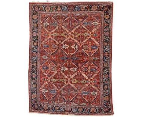 Sultanabad Carpet West Iran, circa 1920 The tomato red field of diamond lattice design containing stylised palmettes and vine