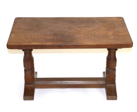 A Robert ''Mouseman'' Thompson Oak 2ft 5in Coffee Table, the rectangular top on two octagonal legs joined by a stretcher, wit