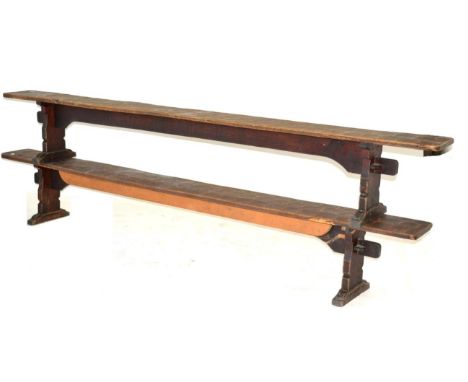 A Pair of Robert ''Mouseman'' Thompson Oak 10ft Benches, on two shaped supports, joined by a rail (top), unmarked, 305cm wide