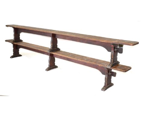 A Pair of Robert ''Mouseman'' Thompson Oak 12ft Benches, on three shaped supports, joined by a rail (top), unmarked, 366cm wi