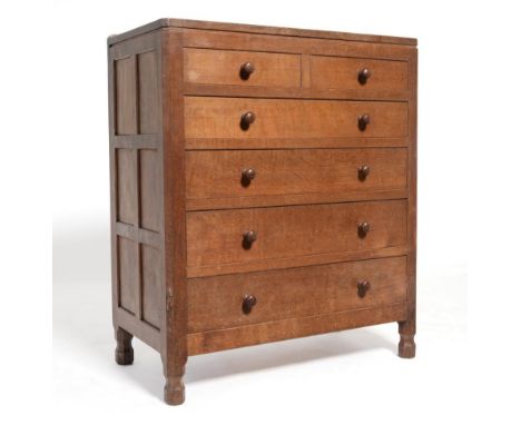 A Robert ''Mouseman'' Thompson Oak Chest of Drawers, with raised upstand above two short over four long graduated drawers, on