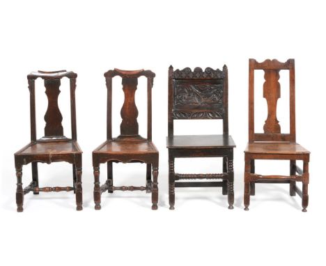 A Late 17th Century Joined Oak Dining Chair, with carved top rail above a panel carved in relief, the boarded seat raised on 