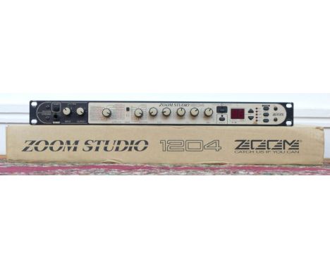 A Zoom 1204 multi effects processor, rack mountable, original box with manual