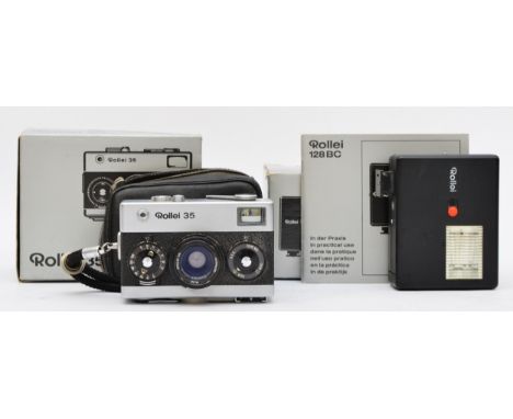 A Rollei 35 film camera (serial No 3495408), boxed with manuals and case, together with a Rollei 128 BC flash unit, boxed wit