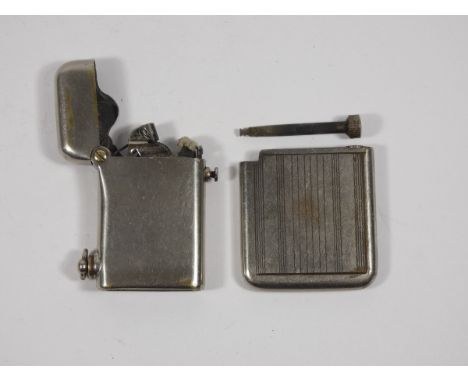 A 1920s Thorens semi automatic gents pocket cigarette lighter, nickel plated brass, petrol operated, together with an Art Dec