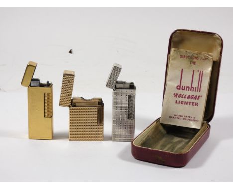 A gold plated Dupont pocket cigarette lighter, together with a silver plated Dunhill 'Rollagas' lighter (boxed) and a gold pl