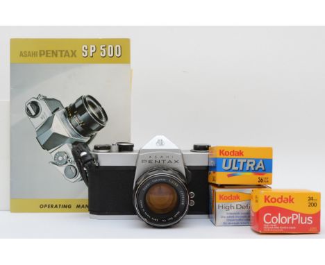 A Asahi Pentax 35mm film camera, with a Super-Takumar 55mm f2 lens, with manual, together with three expired rolls of films, 