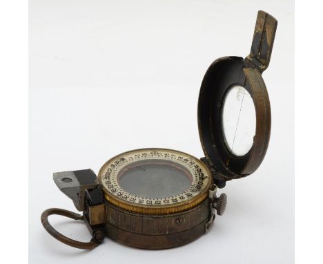 A WWII War Department military compass, by T.G. Co., Ltd, broad arrow and 1941 stamps 