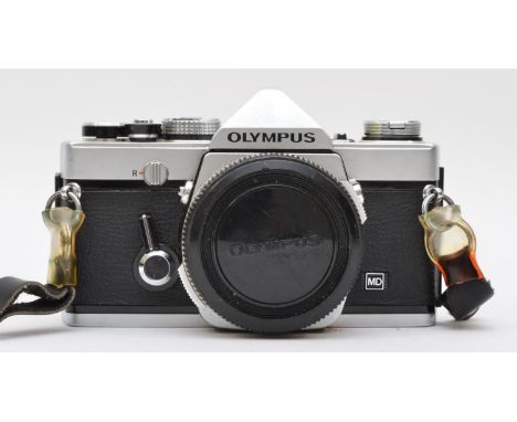 A Olympus OM-1 MD 35mm film camera, body only, with manual, working 