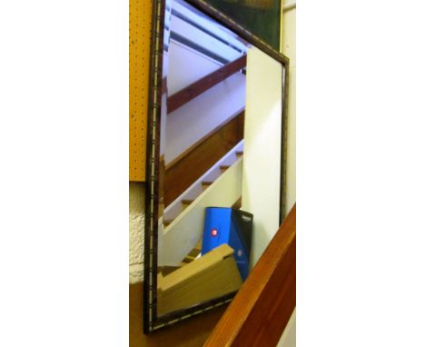 A decorative frame bevelled mirror