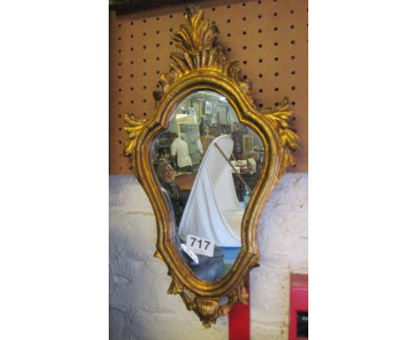 A small gilt framed mirror