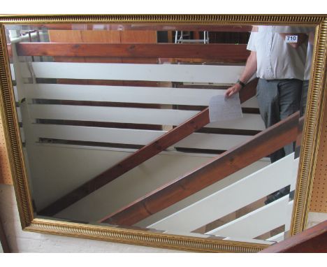 A gilt framed mirror
