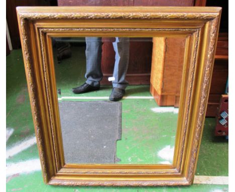 A gilt framed rectangular bevelled mirror