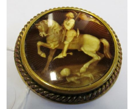 A signed brooch with enamel centre man on horse