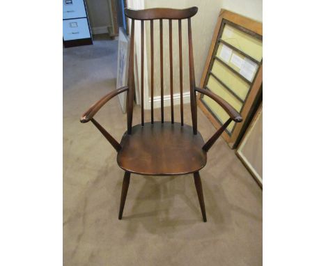 A dark ercol elbow chair