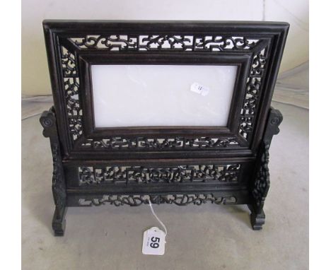 A Chinese jade panel in carved frame