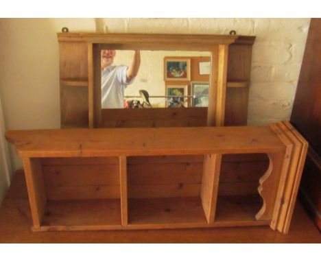 A pine cupboard, white shelf, a pine shelf and a mirrored shelf