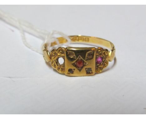 An 18ct gold and ruby ring (one stone deficient) 1.8gm