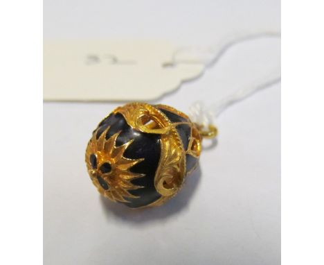 A blue enamel pierced egg shaped pendant