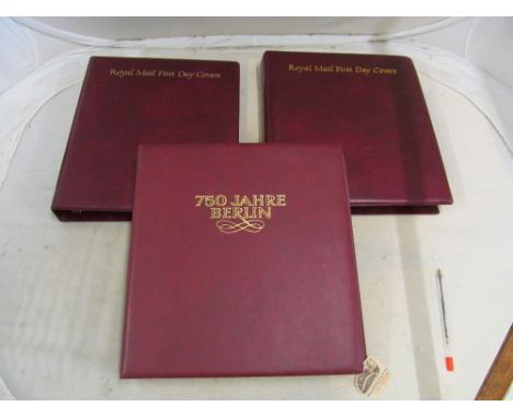 Two albums of first day covers and an album 750 Jahre Berlin stamps and coins