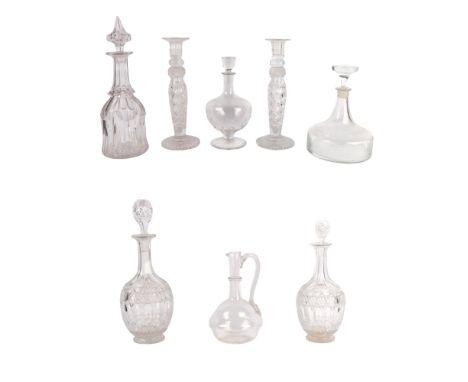 A pair of cut glass candlesticks, 30cms high; together with a group of decanters (8).