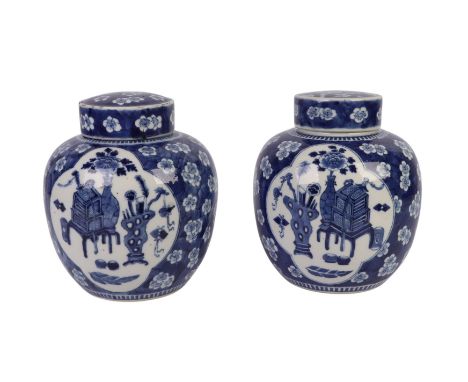 Two Chinese blue & white ginger jars and covers decorated with precious objects on a prunus and cracked ice ground, six chara